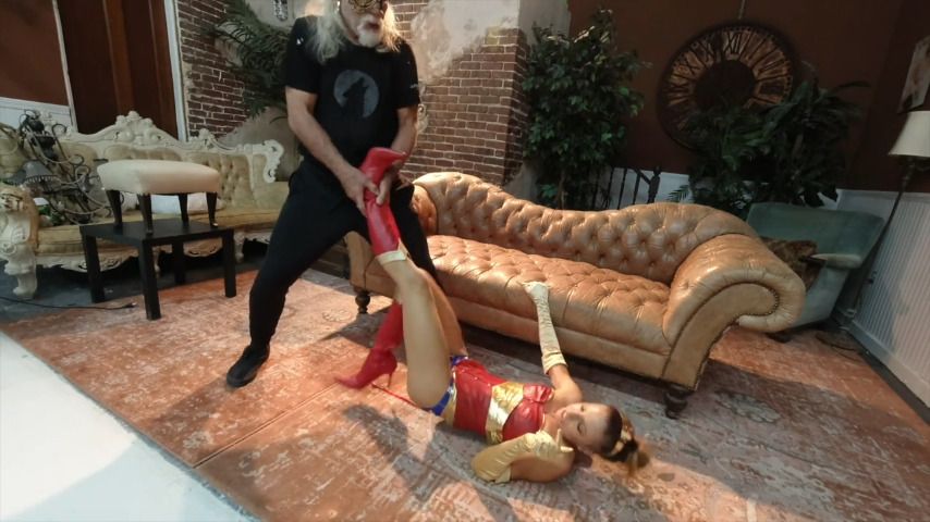 Poster for Lora Cross - Manyvids Girl - Wonderwoman Struggles In 2 Boots - March 23, 2021 - Damsel In Distress, Struggling (Лора Кросс Девушка В Беде)